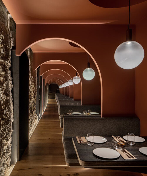 YOD group inserts a copper bridge into historical building turned restaurant in central kiev
