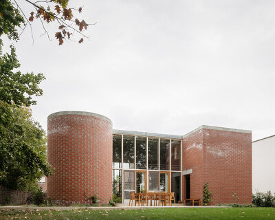BLAF architecten clusters geometric brick volumes to form its fmM house in belgium