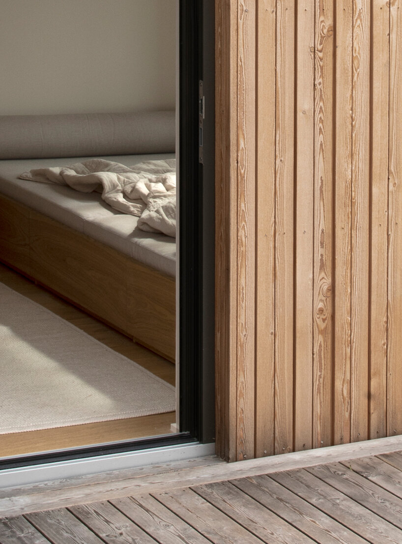 with its archipelago house, NORM architects wraps the coast of sweden in timber