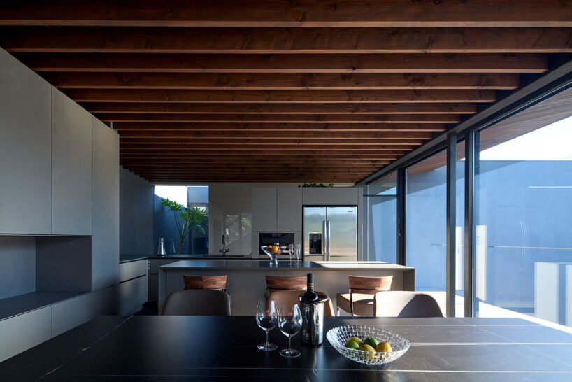 apollo architects & associates develops 'noble house' in japan around verdant garden