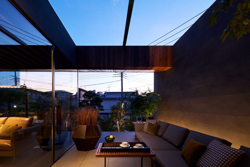apollo architects & associates develops 'noble house' in japan around verdant garden
