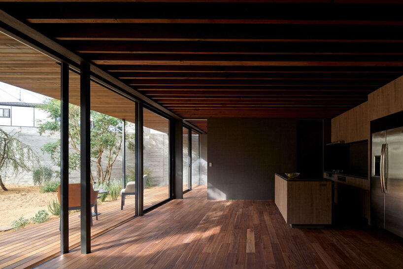 apollo architects & associates develops 'noble house' in japan around verdant garden