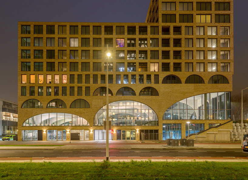 86 arches form studioninedots' 'westbeat' housing complex in amsterdam  