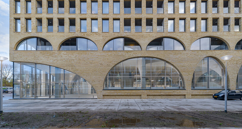 86 arches form studioninedots' 'westbeat' housing complex in amsterdam  