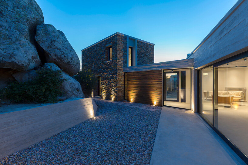 aristides dallas architects sets three-volume house between the rocks of tinos island