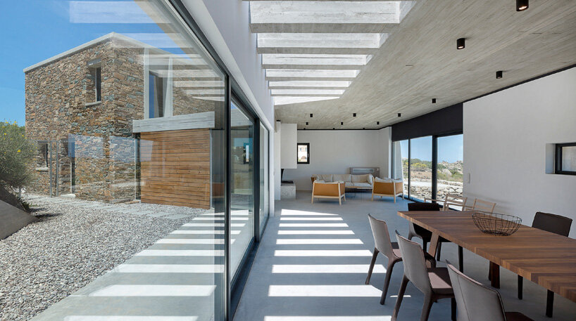 aristides dallas architects sets three-volume house between the rocks of tinos island