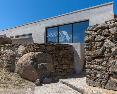 aristides dallas architects sets three-volume house between the rocks of tinos island
