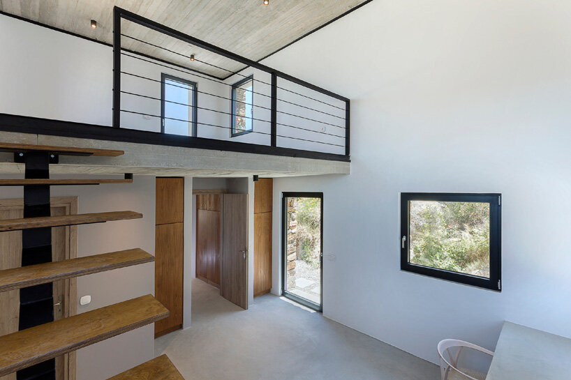 aristides dallas architects sets three-volume house between the rocks of tinos island