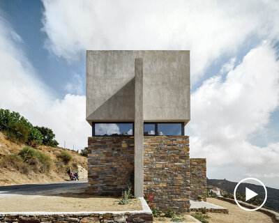 aristides dallas architects adds concrete cube to the existing stonework of this greek house