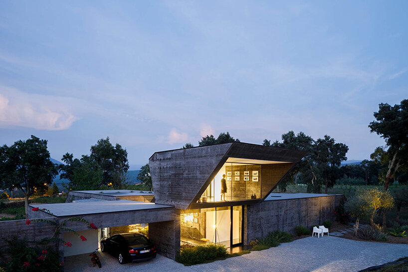 hugo pereira's cork oak house rises from the ground like a rock landform