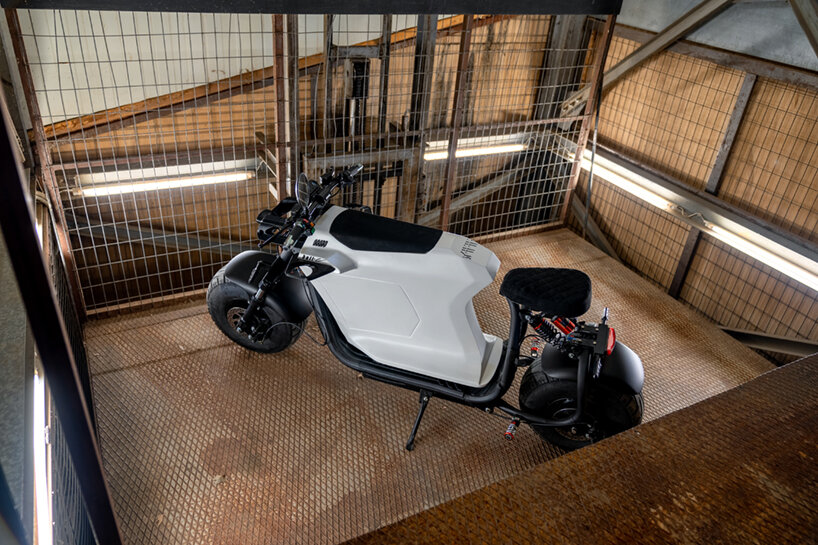 'bull-e' electric scooter merges faceted geometries with a cafe racer stance