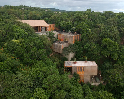 em-estudio's la extraviada house suggests a cluster of boulders over oaxaca