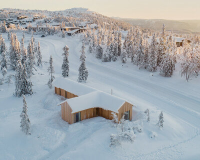 erling berg nestles its kvitfjell cabin atop a white mountain in norway