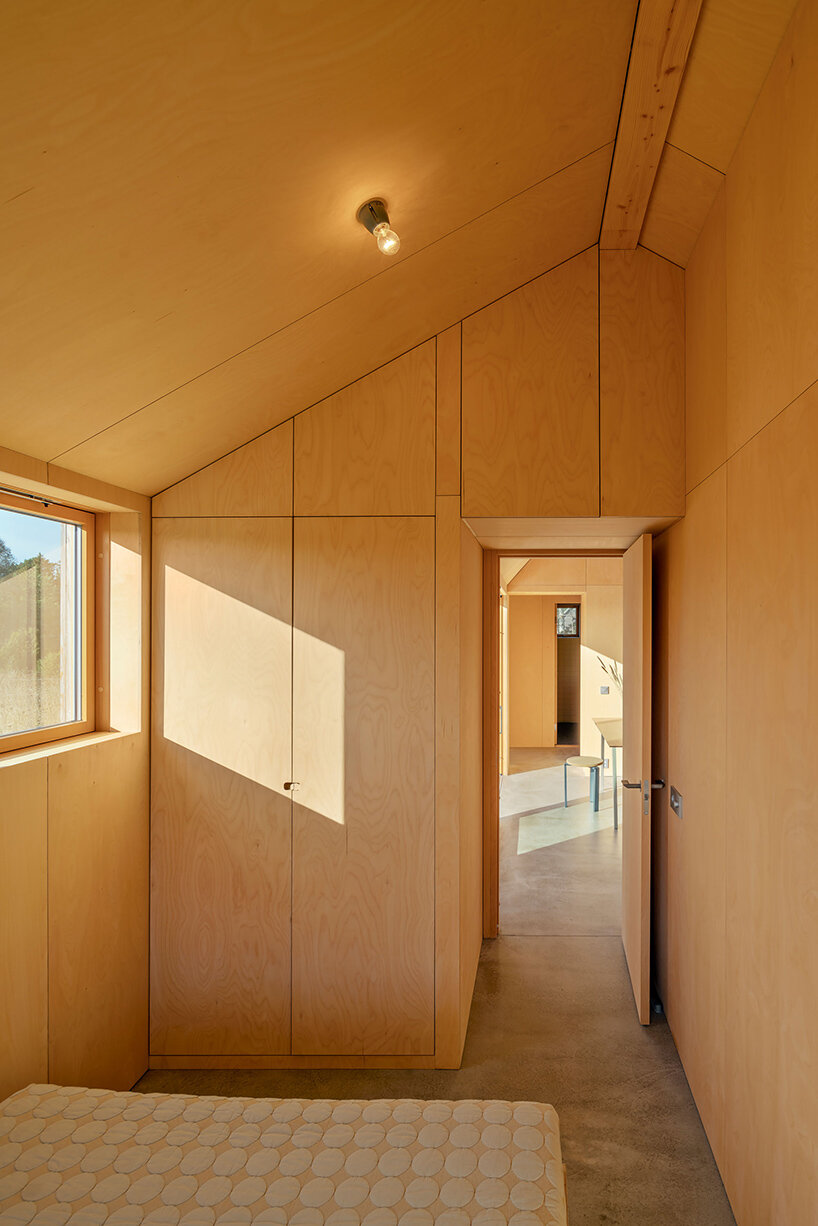 lookofsky architecture clusters timber volumes to realize its 'field house' in fårö, sweden