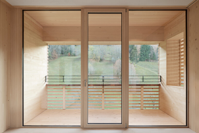 firm architekten builds cube house in austria using timber from the owner's private forest