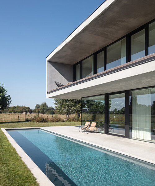 'residence DDE' by govaert & vanhoutte architects is a minimal concrete villa in rural belgium