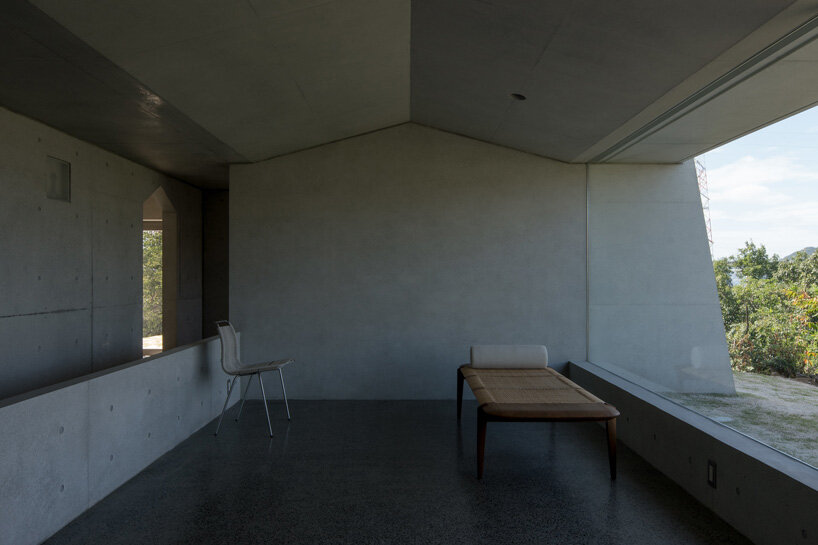 kazunori fujimoto architects builds fort-like house in japan with thick concrete exterior