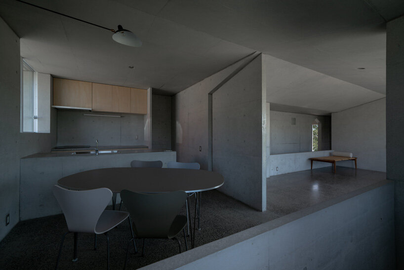 kazunori fujimoto architects builds fort-like house in japan with thick concrete exterior
