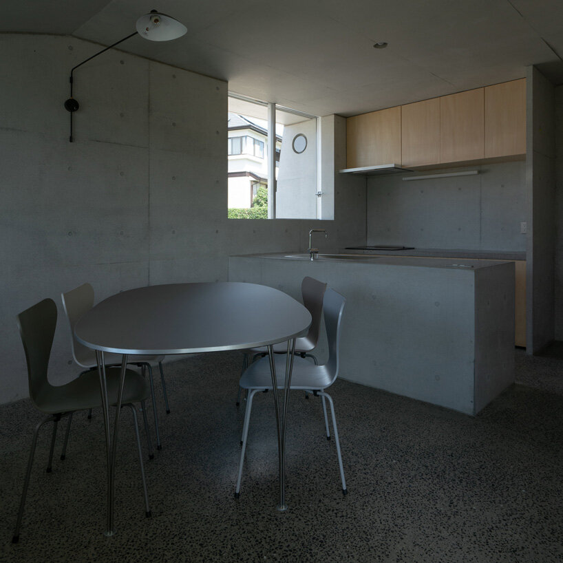 kazunori fujimoto architects builds fort-like house in japan with thick concrete exterior