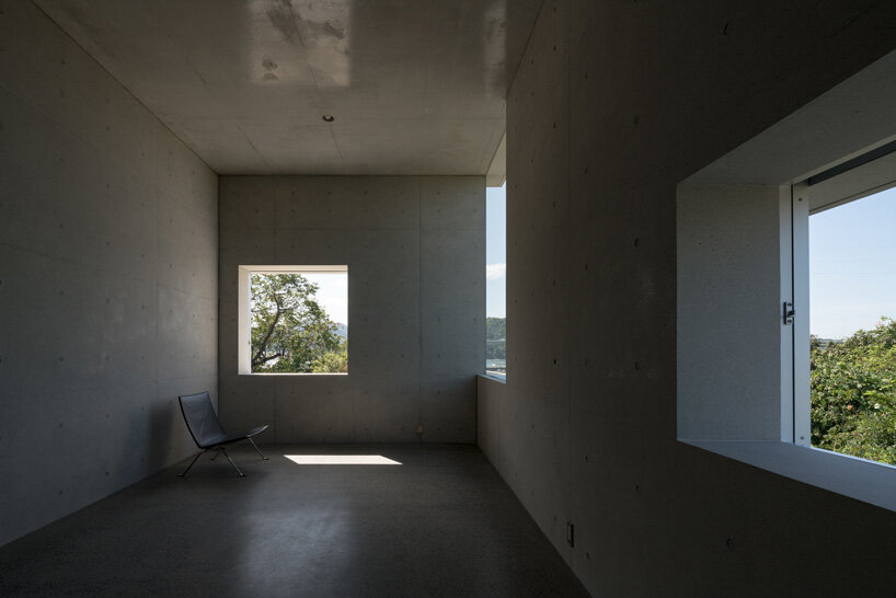 kazunori fujimoto architects builds fort-like house in japan with thick concrete exterior