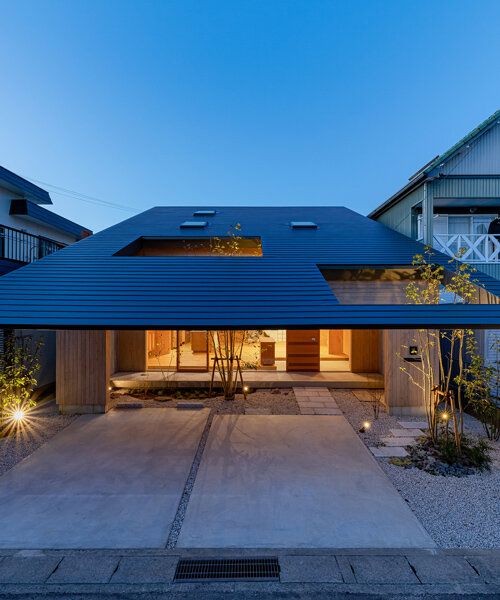 tatsuya kawamoto + associates encloses its imaise house with a broad, overhanging roof