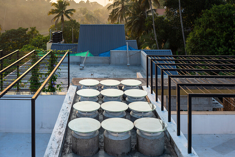 'house that rains light' by LIJO.RENY.architects is overflowing with greenery in kerala, india