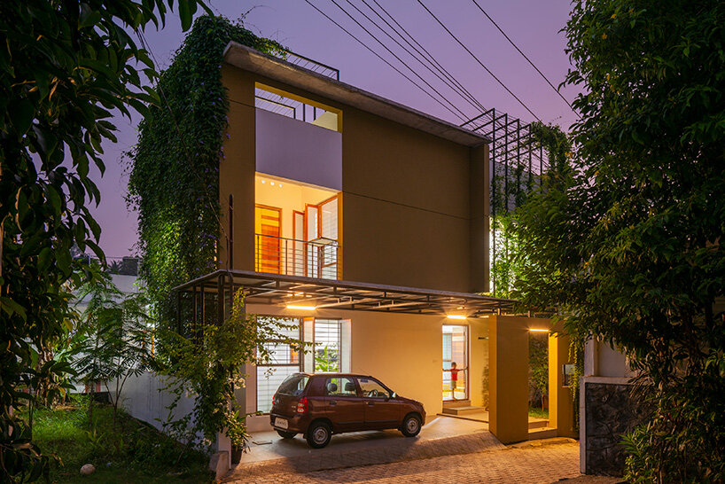 'house that rains light' by LIJO.RENY.architects is overflowing with greenery in kerala, india