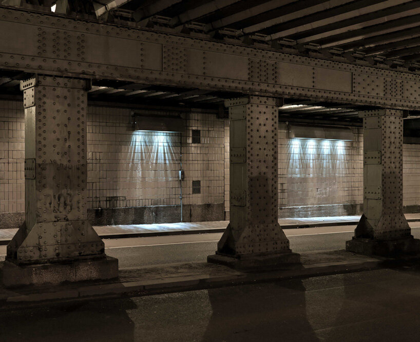 passersby activate dynamic projections in matthias oostrik's light installation in amsterdam