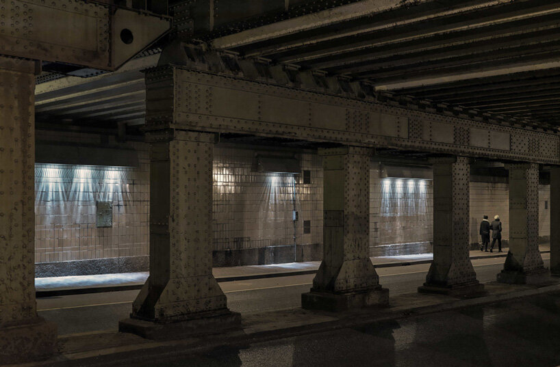 passersby activate dynamic projections in matthias oostrik's light installation in amsterdam