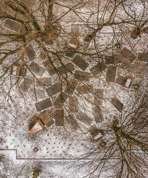 gray sandstone slabs compose NArchitekTURA's great synagogue memorial park in poland