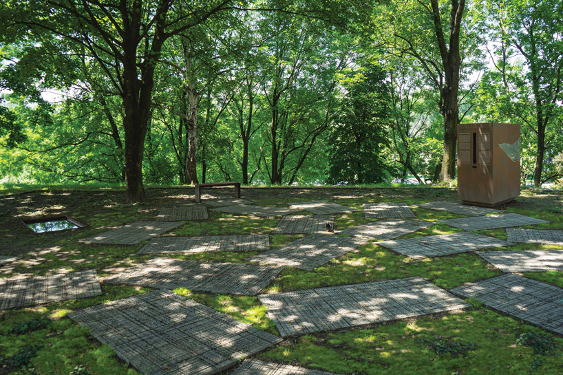 gray sandstone slabs compose NArchitekTURA's great synagogue memorial park in poland