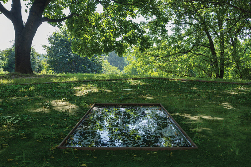 gray sandstone slabs compose NArchitekTURA's great synagogue memorial park in poland