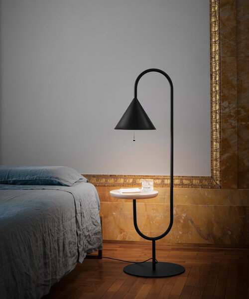 slender black metal forms the 'ozz' lamp collection by paolo cappello + simone sabatti for miniforms