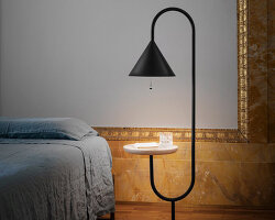 slender black metal forms the 'ozz' lamp collection by paolo cappello + simone sabatti for miniforms