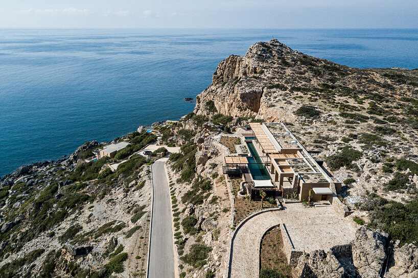 paly architects sets holiday residence on a steep rocky slope in crete, greece
