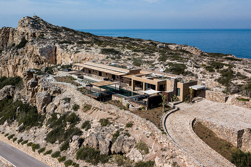 paly architects sets holiday residence on a steep rocky slope in crete, greece