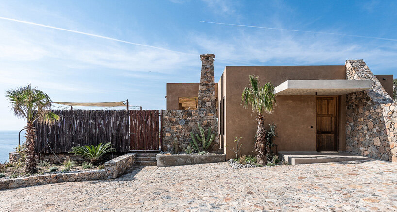 paly architects sets holiday residence on a steep rocky slope in crete, greece