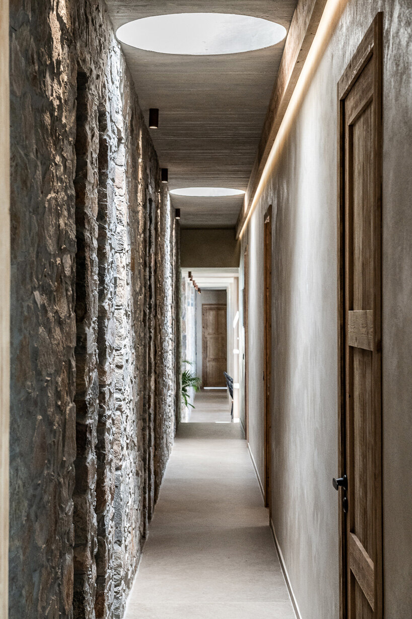 paly architects sets holiday residence on a steep rocky slope in crete, greece