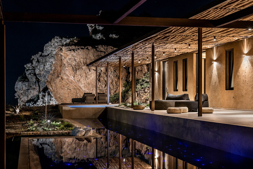 paly architects sets holiday residence on a steep rocky slope in crete, greece