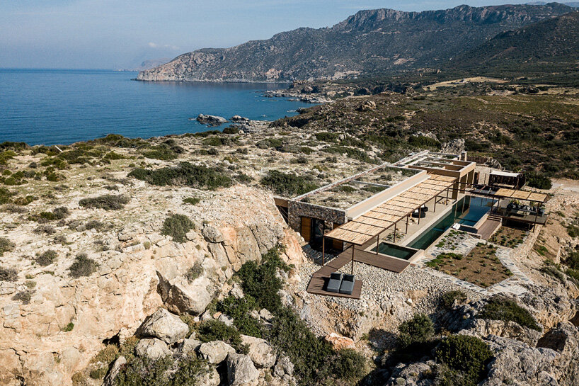 paly architects sets holiday residence on a steep rocky slope in crete, greece