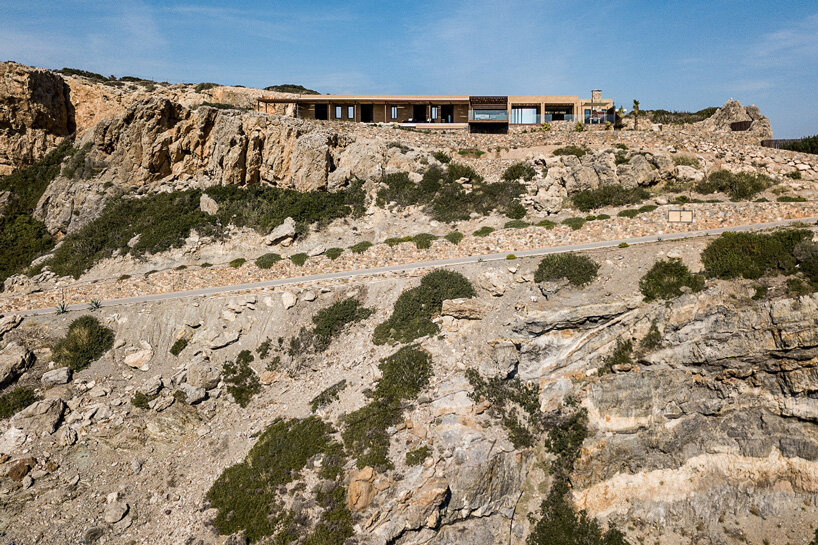paly architects sets holiday residence on a steep rocky slope in crete, greece