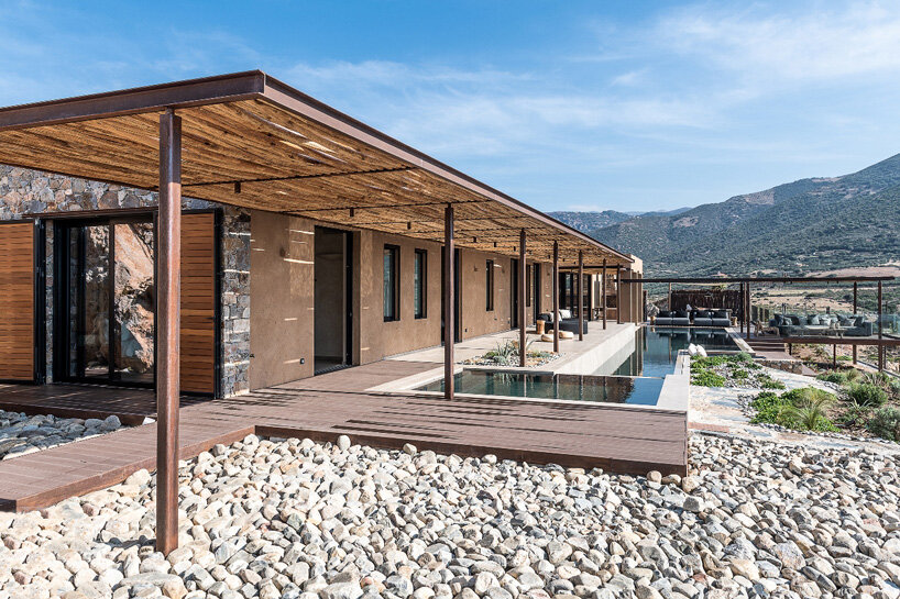 paly architects sets holiday residence on a steep rocky slope in crete, greece