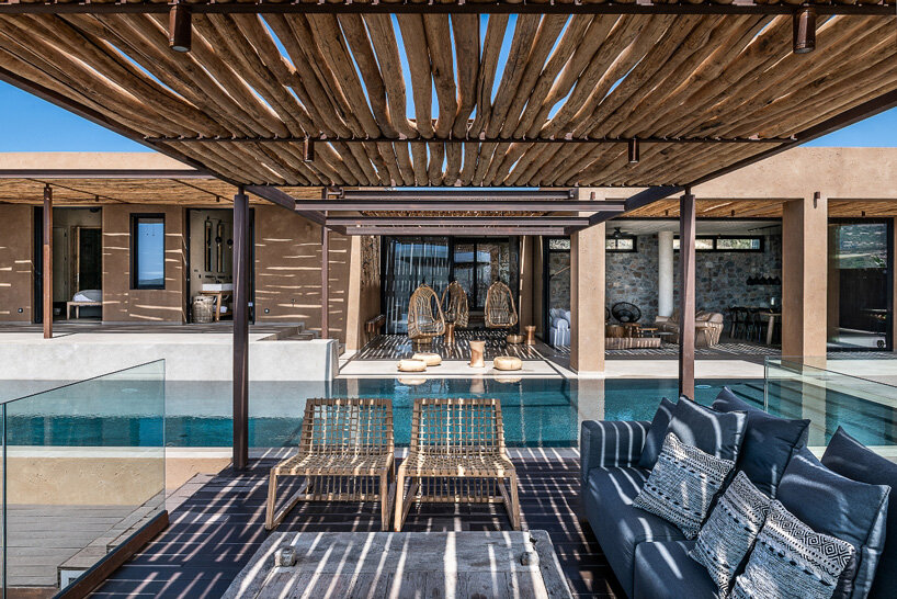 paly architects sets holiday residence on a steep rocky slope in crete, greece