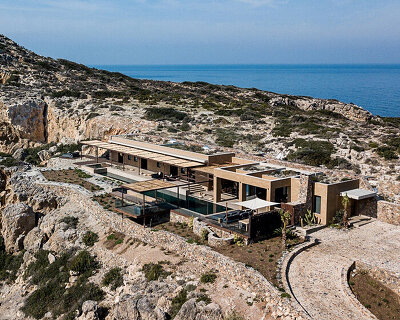 paly architects sets holiday residence on a steep rocky slope in crete, greece