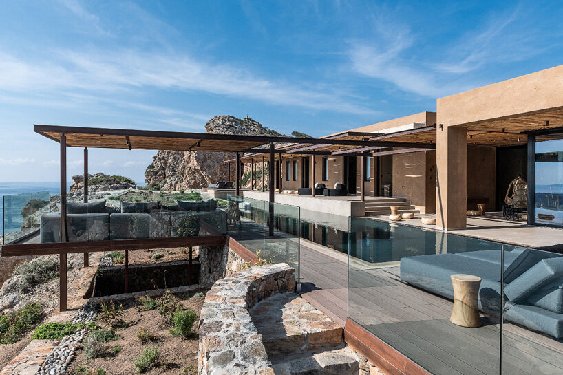 paly architects sets holiday residence on a steep rocky slope in crete ...