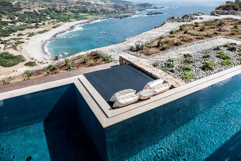 paly architects sets holiday residence on a steep rocky slope in crete, greece