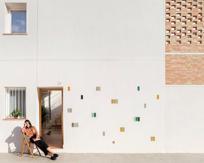 a perforated brick terrace tops this family house in valencia by piano piano studio