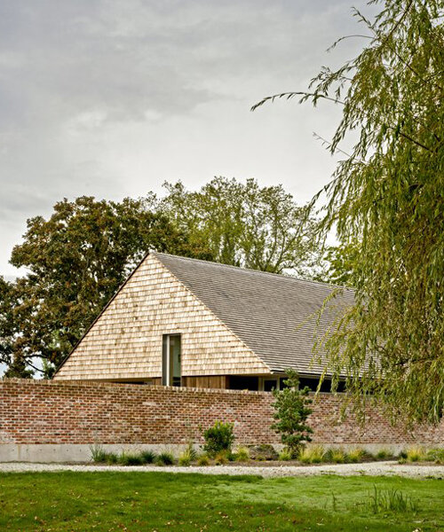 salvaged brick and locally-sourced timber build 'saanich farmhouse' in canada