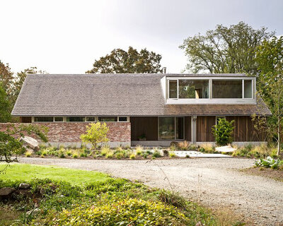 salvaged brick and locally-sourced timber build 'saanich farmhouse' in canada