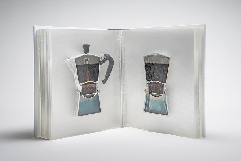 a sliced coffee pot encased in resin pages forms the dissected 'bialetti book' by studio oefner